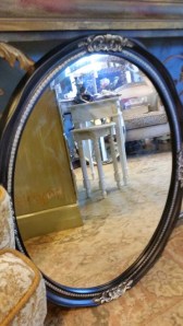 Oval Mirror in black with a little gold accent